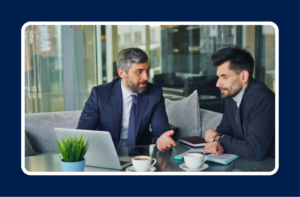 Tech mentorship meeting between two professionals discussing career growth and guidance in a modern office setting