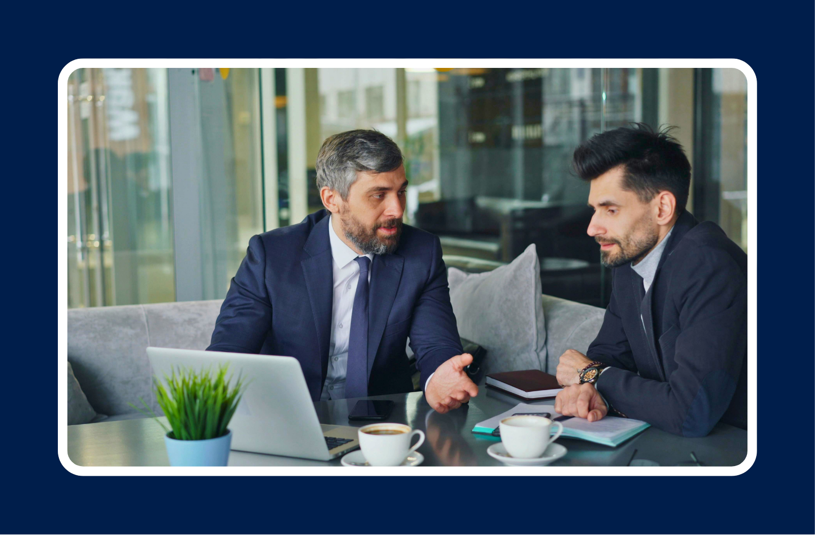 Tech mentorship meeting between two professionals discussing career growth and guidance in a modern office setting