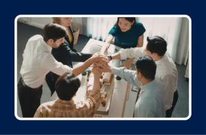 Employees collaborating in office demonstrating effective technical talent retention strategies