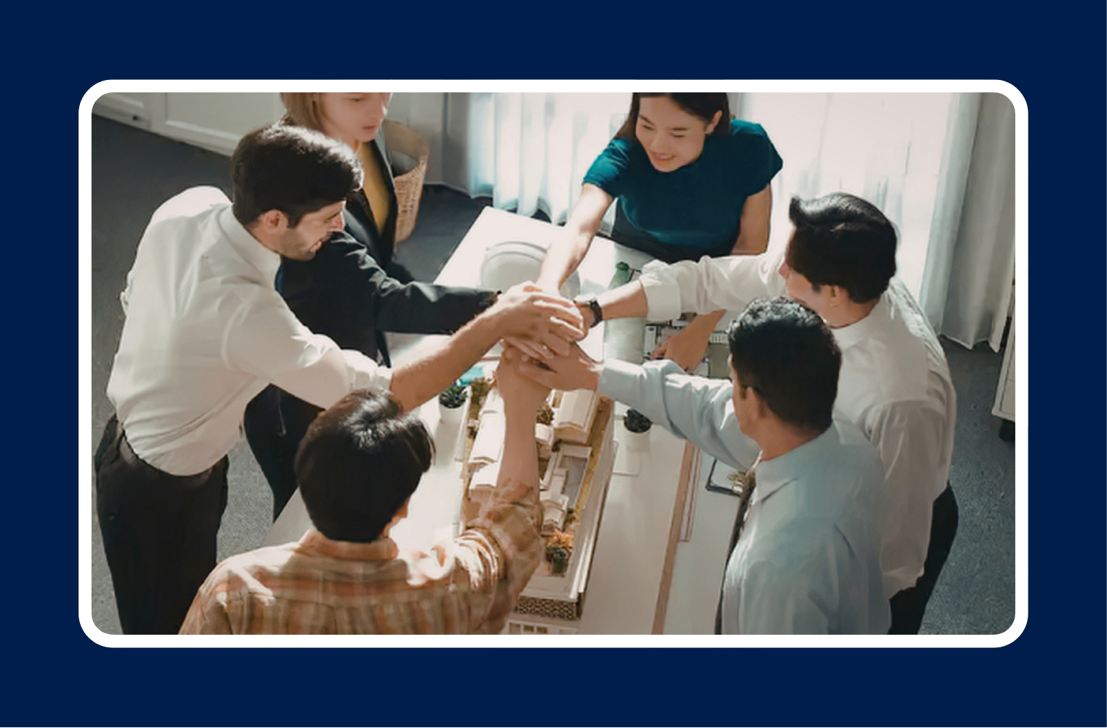 Employees collaborating in office demonstrating effective technical talent retention strategies