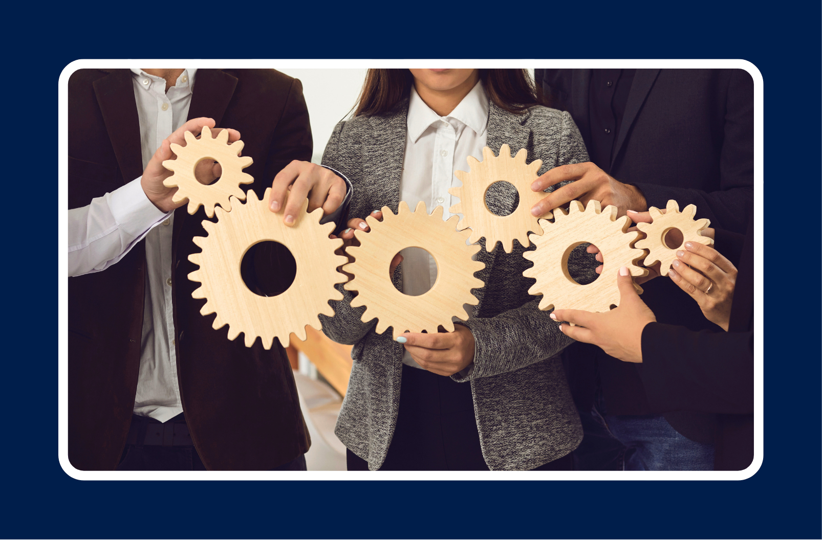 Three business professionals holding interlocking wooden gears, representing a collaborative AI adoption strategy built on people, process, and change management.
