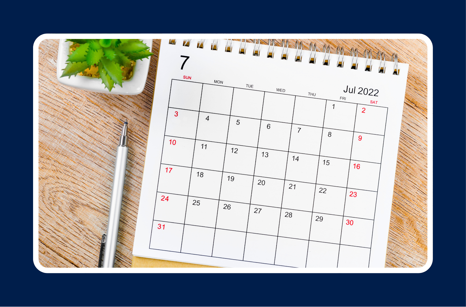 Mid-Year Career Review checklist with a July calendar, notebook, and pen on a wooden desk for career planning and goal setting.